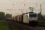 186 238 der Captrain mit einem Getreidezug bei der Durchfahrt durch Hilden am 11.04.2011