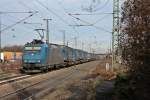 Durchfahrt am 25.01.2014 von der Alpha Trains/Crossrail 185 536-0 mit einem LKW Walter KLV in Müllheim (Baden).