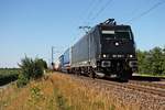 Mit einem KLV aus Antwerpen/Aachen West kam am 10.07.2015 die MRCE/ SBB Cargo International 185 569-1 bei Hügelheim vorbei in Richtung Schweizer Grenze.