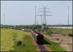 247 011-0 der Euro Cargo Rail kommend vom Massenschttgutlager mit Ihren Kohlewagen unterwegs auf dem Nordgleis in Wilhelmshaven.