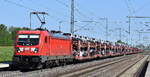 DB Cargo AG, Mainz mit ihrer 187 149  [NVR-Nummer: 91 80 6187 149-0 D-DB] und einem PKW-Transportzug (fabrikneue SEAT PKW-Modelle) am 30.04.24 Höhe Bahnhof Rodleben.