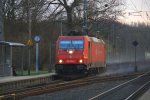 185 595-6  Ruth  kommt als Umleiter mit einem Containerzug aus Aachen-West in Richtung Herzogenrath.
Aufgenommen bei der Durchfahrt in Kohlscheid. am 6.3.2012.