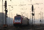185 601-2 von Crossrail fhrt mit einem Containerzug aus Belgien nach Italien bei der Abfahrt aus Aachen-West und fhrt in Richtung Aachen-Hbf,Kln in der Abendstimmung am 29.3.2013.