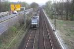 Eine 185 556-8 kommt mit einem Gterzug fhrt durch Bad-Honnef auf der Strecke Koblenz-Kln.
27.3.2011