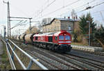 Silozug mit 077 023-5 (EMD JT42CWR) der Mitteldeutschen Eisenbahn GmbH (MEG) durchfährt den Bahnhof Niemberg auf der Bahnstrecke Magdeburg–Leipzig (KBS 340) Richtung Köthen.