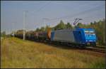 CFL Cargo 185 520-4 mit einem Kesselwagen-Zug am 16.09.2014 durch die Berliner Wuhlheide (NVR-Nummer 91 80 6185 520-4 D-CFLCA)