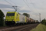 Mit einem Kesselwagenzug aus der Schweiz fuhr am 12.05.2015 die 119 005-6  RheinCargo  bei Hügelheim in Richtung Freiburg.