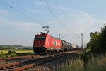 Mit einem Kesselzug aus der Schweiz, fuhr am 11.06.2015 die RheinCargo 2053 (185 585-7) zwischen Müllheim (Baden) und Buggingen in Richtung Norden.