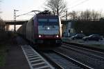 Durchfahrt am 16.03.2014 von 185 591-5 mit einem Containerzug in Orschweier.
