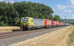 193 556-8 mit einem Aufliegerzug am 10.07.2025 bei Himmelstadt.
