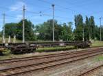 Einer von 17 abgestellten Oberbaustoffwagen in Bergen/Rgen ist dieser Slps-Wagen 82 80 4727 205-3.Aufnahme am 28.Juni 2011.