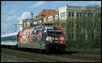 Werbelok 101068 Bayer Leverkusen passiert hier am 29.4.2001 das Automuseum in Melle. Die Lok ist mit dem Interregio 2343 Havelsee nach Berlin unterwegs.