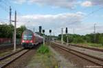 112 184-7 verlsst gerade mit einer RE2  Ersatzgarnitur  als (RE 37387) von Rathenow nach Knigs Wusterhausen den Rathenower Bahnhof.