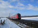 RE 21416 Hamburg Hbf - L�beck Hbf rast am 14.02.09 durch die verschneite Landschaft zum n�chsten Halt nach Reinfeld (Holst.).