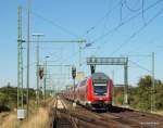 RE 21577 L�beck Hbf - Hamburg Hbf passiert am 19.08.09 die s�dliche Bahnhofsausfahrt von Bad Oldesloe auf dem Weg nach Hamburg Hbf. Aufgenommen von einer kleinen Erhebung an der Strecke.