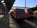 Ein Kamelzug der RAB mit einer 218 als Schublok als Ire 4207 nach Lindau hbf abfahrbereit in Ulm hbf.