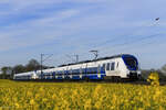 442 860 und 442 359 (National Express) als RE7 Richtung K�ln Messe/Deutz in Meerbusch B�singhoven, 8.