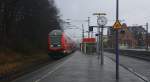 Der RE1 aus Paderborn-Hbf nach Aachen-Hbf und hält in Stolberg-Hbf(Rheinland)  und am Zugende ist die 146 030 DB bei Regenwetter am Nachmittag vom 24.12.2014.