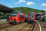 Zugbegegung im Bahnhof Betzdorf/Sieg am 19.08.2013:

Links 442 256 / 756 viertieliger Bombardier Talent 2 als RE 9 (rsx - Rhein-Sieg-Express) Siegen - Kln - Aachen und rechts der lokbespannte (mit 120 207-6) Gegenzug mit sechs DoSto-Wagen.

In 1200 Pixel war es einfach nicht berzeugend, somit nun in 1024!