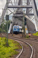 TCS-RE13 mit 101 133-7 über die Rheinbrücke, fotografiert vom Haltepunkt Düsseldorf-Hamm am 07.06.2025