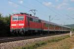 Am 08.07.2013 fuhr 111 061 mit offener Tr und der RB 26571 (Offenburg - Basel Bad Bf) aus dem Bahnhof von Kollmarsreute an Sexau vorbei Richtung Denzlingen.