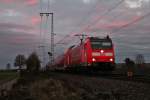 Hier die 146 110-2  Müllheim (Baden)  am späten Abend des 07.12.2013 mit einem RE nach Basel Bad Bf nördlich von Müllheim (Baden).