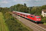 Nachschuss auf 111 054 am 22.08.2014 in der untergehenden Sonne mit einer RB (Schliengen - Offenburg) bei der EInfahrt in Müllheim (Baden).