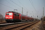 Einfahrt von der 111 048-5 als Ersatz für eine ausgefallene 146.1 des BW Freiburg am 18.03.2015 mit einem RE (Offenburg - Basel Bad Bf) in Orschweier.