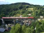 111 057 schiebt eine RB nach Saalfeld(Saale) am 09.Juni 2012 ber das Trogenbachviadukt in Ludwigsstadt.