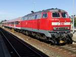 218 493-5 mit RB 57349 von Füssen nach Augsburg am 07.08.2012 im Bahnhof von Buchloe.