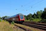 Der RE 5 von Stralsund Hbf nach Falkenberg (Elster) fährt am 23.07.2014 durch den ehemaligen Bahnhof Fichtengrund.