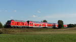 245 018 zieht einen RB34-Verstärker nach Glauburg Stockheim und wurde hier zwischen Altenstadt-Lindheim und Glauburg-Glauberg fotografiert.