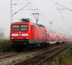 112 104-5 mit RE 4306 von Rostock Hbf nach Hamburg Hbf bei der Durchfahrt in Sildemow.09.09.2012