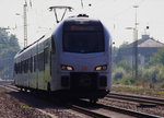 Im Gegenlicht! 429 122 ist als RE (Süwex) nach Koblenz unterwegs und durchfährt gerade die Gleisanlagen des Bahnhof´s Bous Saar.