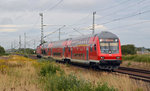 Eine RB aus Wittenberg nach Bitterfeld, geschoben von 143 926, erreicht am 04.09.16 in Kürze den Haltepunkt Gräfenhainichen.