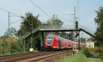 Nach der Berufsschule konnte ich den RE 21419 auf dem Weg von Lbeck Hbf nach Hamburg Hbf kurz nach der Durchfahrt in Ahrensburg beim passieren einer Fugngerbrcke in der nhe des Ahrensburger