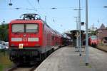 112 111-0 mit RE 18591 von Warnemnde nach Berlin Hbf(tief)abgestellt im Bahnhof Warnemnde.29.05.2014