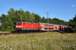RE1 des Hanse-Express mit der 112 104-5 in Front, kurz vor der Einfahrt am Bahnhof Büchen.
