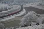 Ein Doppelstock-RegionalExpress, geschoben von Tfz des Typs BR 146.2, ist am 27.12.07 auf der Filsbahn (KBS 750) in Richtung Ulm unterwegs, aufgenommen bei Lonsee.