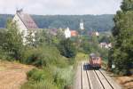 Ein IRE fhrt gen Ulm hbf. Eine 218 schiebt den IRE zum nchsten Halt - Aulendorf.
Aufgenommen am 3.08.2012 von einer Brcke bei Zollernreute.