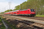 147 011 mit dem RB 32 nach Ludwigsfelde am 11. März 2023 bei Diedersdorf auf den äußeren Berliner Aussenring.