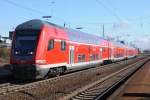 RB 75 von Aschaffenburg nach Wiesbaden Hbf verlt Gro Gerau nach seinem planmigen Halt. (Mrz 2009).