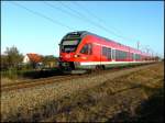 427 002-1 als RE 33214 von Sassnitz nach Rostock Hbf durchfährt am 04.12.2007 die Ortschaft Kummerow.