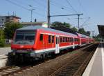 Ein DB Regio mit der 112 171-4 am Ende, 3 Dostos und ein n-Steuerwagen am Bahnhof in Ahrensburg.