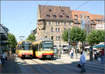 In der Mitte von Heilbronn -    Begegnung zweier Generationen Mehrsystemstadtbahnwagen an der Haltestelle Heilbronn Rathaus im Herzen der Stadt.