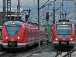 Die Triebzüge 1440 313-3 und 422 534-8 fahren im Juni 2018 in den Hauptbahnhof Dortmund ein.