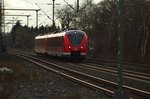 Eine aus Lürrip kommende S8 fährt gerade in Korschenbroich ein, vorne ist der 1440 302-6 am 23.3.2016