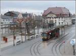 Am diesem regnerischen frhen Morgen ersphe ich aus dem Hotelzimmer diesen Strassenbahnwagen und den Bahnhof der Harzer Schmalspurbahnen in Nordhausen.
