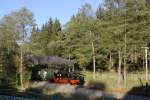99 4511 am 02.10.2011 auf dem Weg nach J�hstadt in Schl�ssel nahe der Fahrzeughalle.