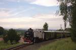 99 731 bringt am 05.08.'12 einen Sonderzug der Zittauer Schmalspurbahnen nach Jonsdorf und befindet sich hier nur noch wenige Meter vor ihrem Endbahnhof